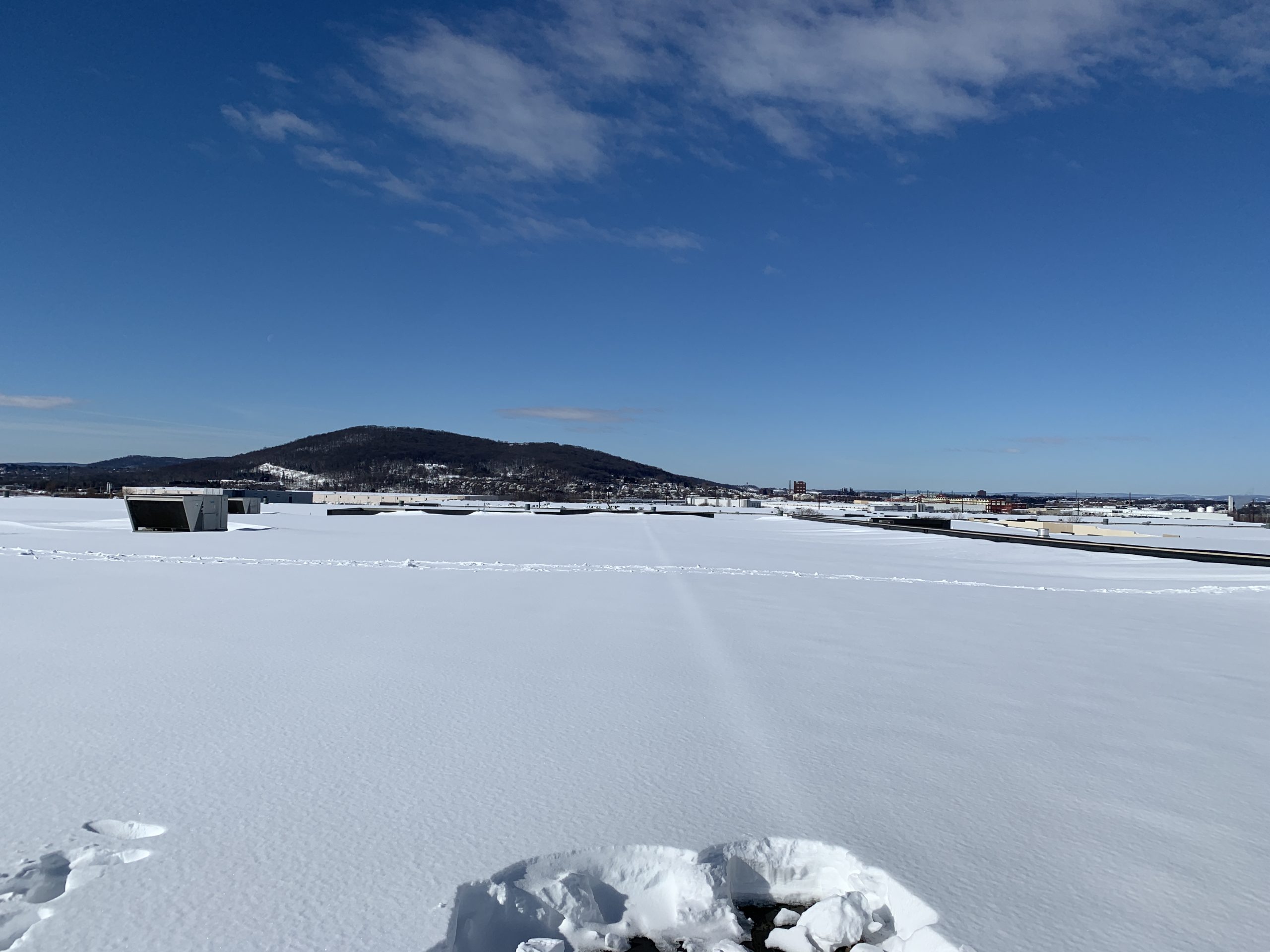 How to Safely Remove Snow From a Commercial Roof GSM Roofing
